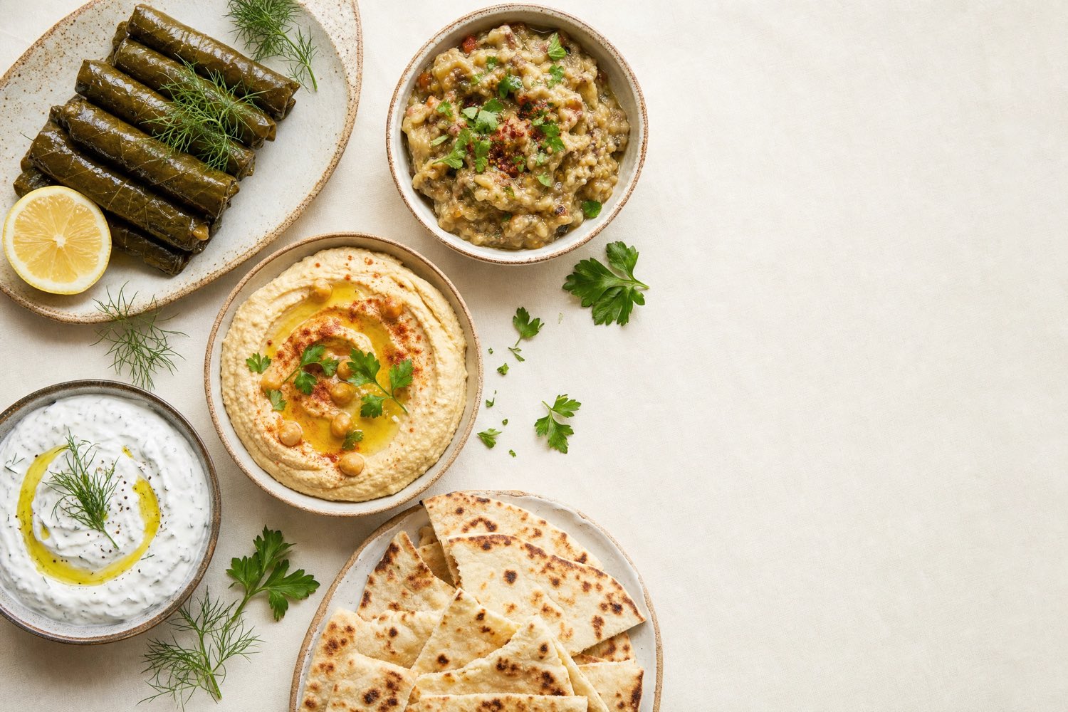 A Turkish meze spread on a dark wooden table